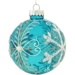Snowflakes On Teal Glass Ornament